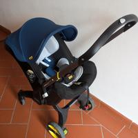 Doona ovetto pieghevole seggiolino auto con ruote