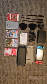 nintendo switch con giochi e accessori