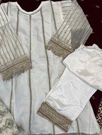 Completo donna bianco con pantaloni .