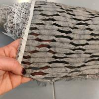 Rotolo di tessuto semitrasparente grigio