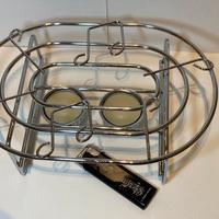 Scaldavivande metallico con note musicali e candel