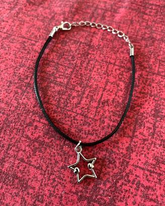 Bracciale in acciaio e corda nera con charm stella