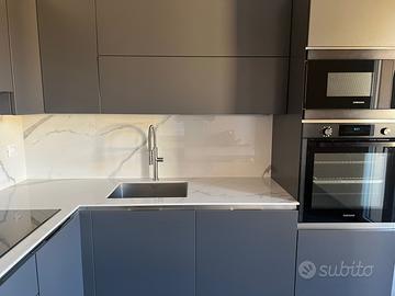 Aredo cucina e camera di letto