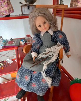 bambola nonna su sedia a dondolo in legno 