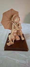Statua di Giuseppe Armani - "Give A Dog A Bone"