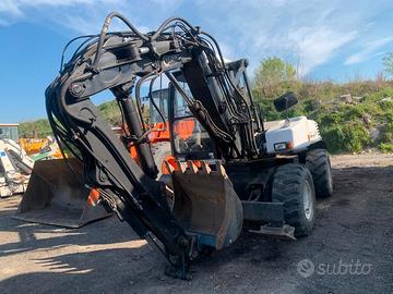escavatore gommato MECALAC 12MXT 