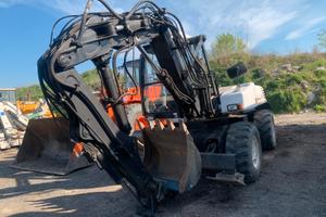 escavatore gommato MECALAC 12MXT 