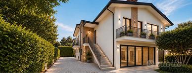 Villa quadrifamiliare in centro con giardino