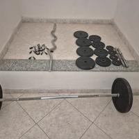 Attrezzatura palestra Decathlon dischi, bilanceri 