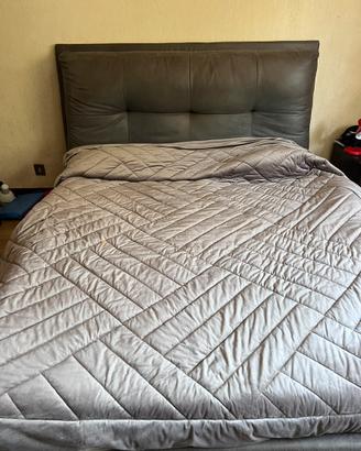 Letto matrimoniale contenitore con testiera imbott