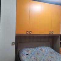 Armadio a ponte arancione + Letto