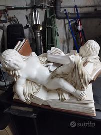 putti statuina angioletti opera d'arte