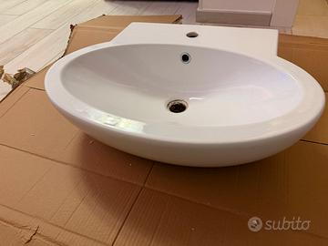 Lavabo ovale in ceramica bianca lucida