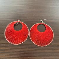 Orecchini rotondi filo intrecciato e perline rossi