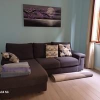 Divano letto ad angolo in tessuto grigio