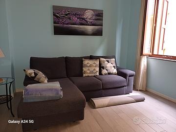 Divano letto ad angolo in tessuto grigio