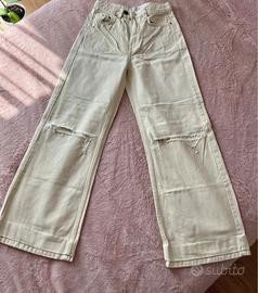Pantaloni wide leg beige strappati