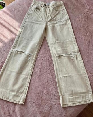 Pantaloni wide leg beige strappati