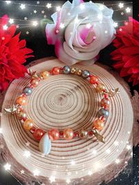 Braccialetto con ciondoli e perline