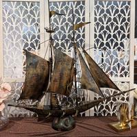 Scultura veliero in metallo patinato