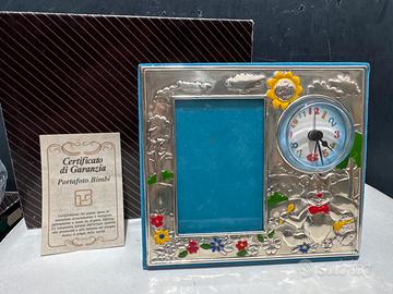 Cornice con orologio