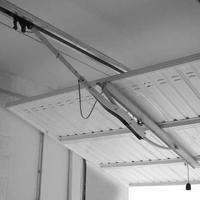 Braccio oscillante per porta del garage Nuovo