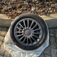 4 cerchi in ferro compresi coperchi e gomme