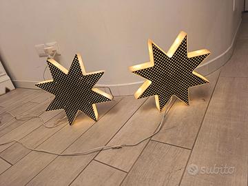Due stelle luminosi luminarie Luci