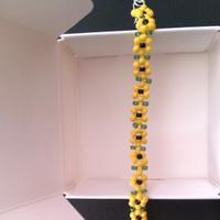 Bracciale e anello a fiori