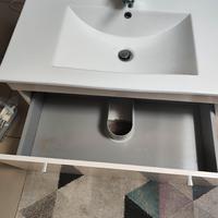 Lavabo bianco con cassetti estraibili e miscelator