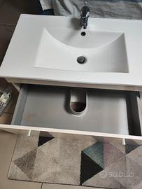 Lavabo bianco con cassetti estraibili e miscelator