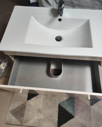 Lavabo bianco con cassetti estraibili e miscelator