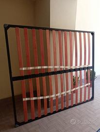 Rete letto contenitore con pistoni