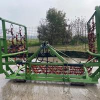 Trattore erpice a strascico per prati