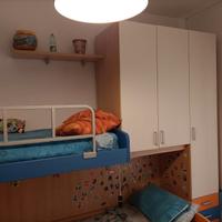 camera  soppalco con scala contenitore con 3 letti