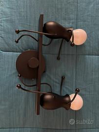Lampada da parete con omini