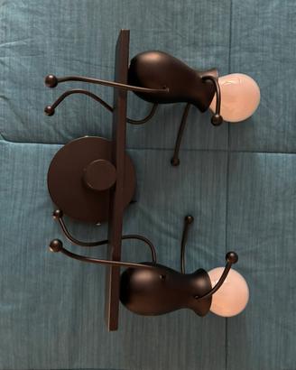 Lampada da parete con omini