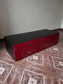 Mobile base TV Ikea Besta con cassetti rossi