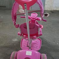 Triciclo rosa musica e luci