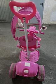 Triciclo rosa musica e luci