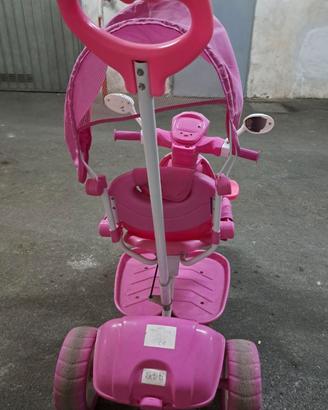 Triciclo rosa musica e luci