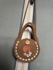 Borsa rotonda con conchiglie
