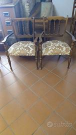 Coppia di antiche poltroncine in legno massello