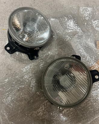 Copia fari anteriori Bosch originali per BMW E21