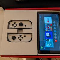 Switch OLED + accessori + giochi