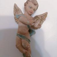 Scultura che rappresenta un putto scorso secolo