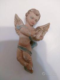 Scultura che rappresenta un putto scorso secolo