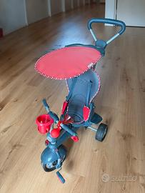 Triciclo evolutivo con maniglione e parasole