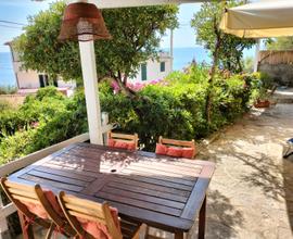 Elegante Casa Vista Mare con giardino a Pomonte