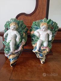 Coppia di antiche fioriere da parete